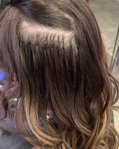Rows of small keratin bonds placed close to the scalp at the back of the head